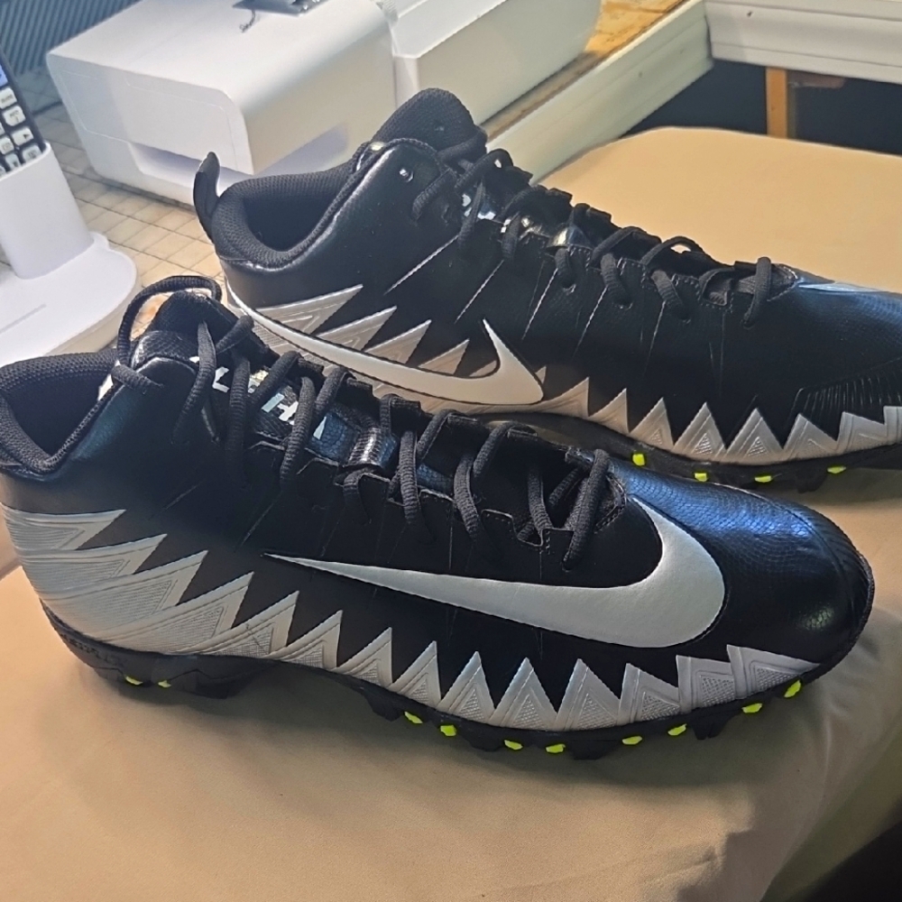 Nike Cleats. Men's Black and White Athletic Shoes